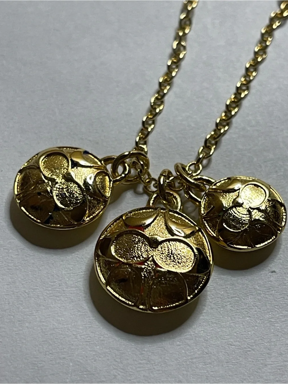 Coach Gold Pendant Necklace with Triple Medallion Reversible Charms